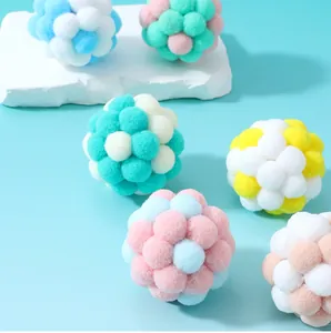 Close-up of colorful macaron plush cat balls with soft textures and vibrant pastel hues.