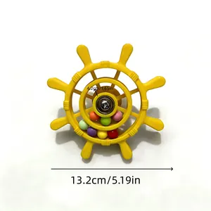 Detail view of yellow parrot ship wheel toy with dimensions 13.2cm and 5.19in