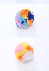 Macro view of colorful fuzzy yarn balls for cat play showing soft texture and vibrant colors