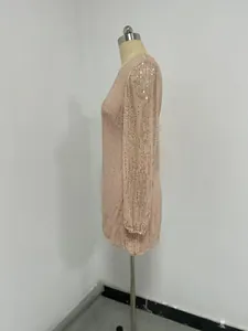 Detailed side view of a rose gold sequin mini dress featuring elegant lantern sleeves