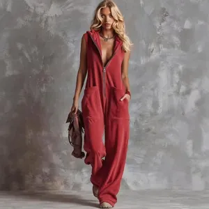 Full length view of a red hooded zip-up sleeveless jumpsuit with pockets.