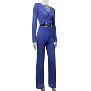 Detailed macro view of the blue hollow-out knitted two-piece set with high-waist trousers