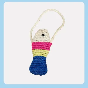 Close-up detail of a colorful woven sisal fish cat toy featuring a durable hanging rope for play