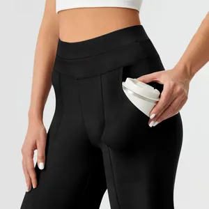 Detail of high-waisted yoga pants featuring a large functional side pocket for storage
