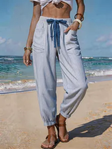 Detail view of striped beach joggers with drawstring and pockets for summer vacation