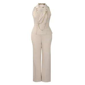 Close-up detail of a beige sleeveless wide-leg jumpsuit with lapel collar and chain trim