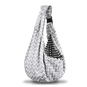 Gray zigzag pet sling carrier with adjustable buckle and checkered lining interior detail