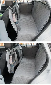 Detail view of grey quilted waterproof pet car seat cover with functional storage pockets.