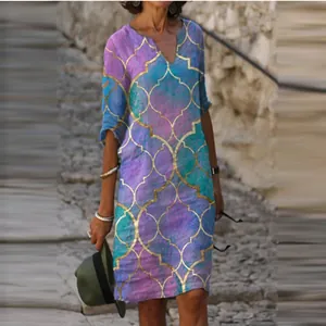 Elegant V-neck vintage dress featuring golden Moroccan print on purple turquoise fabric