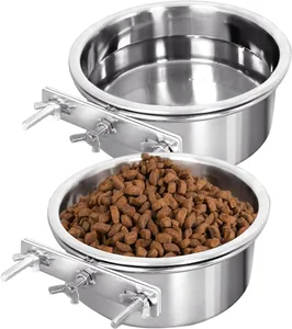 Detail view of two hanging stainless steel pet bowls with secure cage mounting brackets