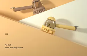 Detailed view of pet bath brushes with long handles and transparent liquid reservoirs