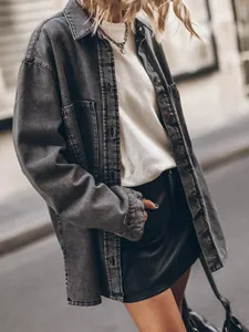 Close-up of vintage oversized grey denim shirt with large pockets and metal buttons