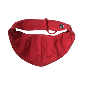 Detailed view of the soft red fabric pet sling carrier for comfortable cat transportation