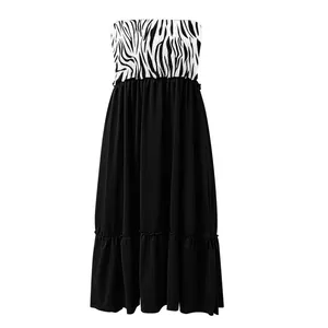Elegant strapless maxi dress featuring a zebra print bodice and flowing black pleated skirt
