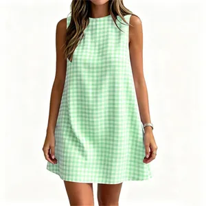 Detailed view of a light green gingham sleeveless dress with a round neckline