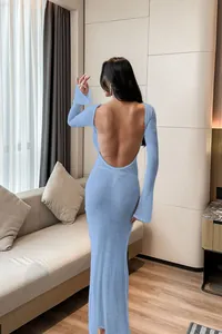 Detailed back view of a sexy light blue long-sleeved backless knit beach cover-up dress.