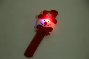 Glowing LED Christmas slap bracelet with red snowman and snowflake design.
