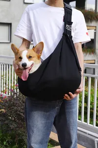 Black adjustable pet sling carrier with breathable fabric for cats and small dogs