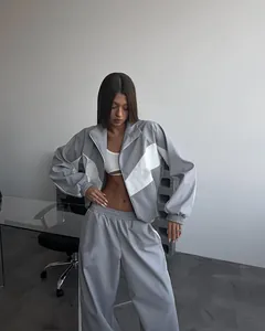 Grey and white color-block tracksuit set with a zip-up jacket and loose-fit pants