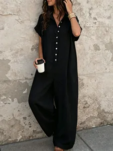 Detailed look at a black casual button-down short sleeve jumpsuit with wide-leg design