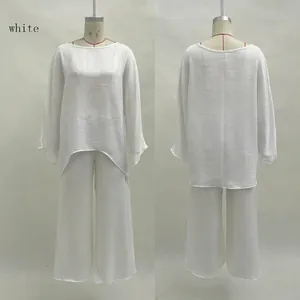 Front and back view of women's elegant loose white blouse and wide-leg pants set