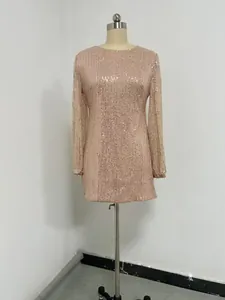 Close-up detail of a champagne sequin mini dress featuring elegant lantern sleeves and round neck.