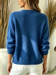 Back view of a soft blue knit sweater with ribbed cuffs and hem for autumn winter fashion