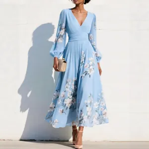 Light blue floral maxi dress with V-neckline and elegant pleated skirt detail