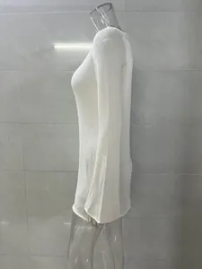 Side view of a white knitted sheer beach cover-up dress shown on a transparent mannequin
