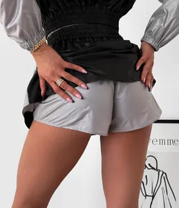 Back view of metallic silver and black sporty two-piece set with shiny fabric