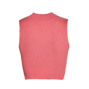 Detailed view of a coral pink ribbed knit sleeveless crop top showing fabric texture