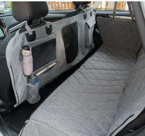 Detail of grey waterproof car dog seat cover featuring storage pockets and mesh window