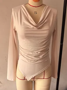 Elegant light pink long-sleeved top with asymmetric hem and draped cowl neck design
