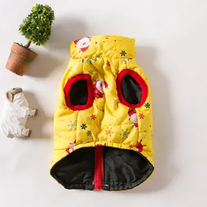 Detailed view of a yellow Christmas dog vest with Santa Claus and snowflake prints