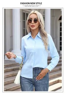 Elegant light blue long-sleeved button-up shirt for women styled with jeans