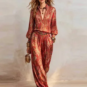 Elegant paisley print two-piece set featuring deep V-neck blouse and wide leg pants