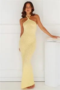 Macro view of the yellow diamond-knit texture on a stylish halter-neck beach dress