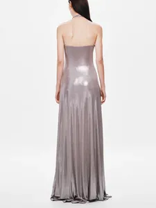 Back view of a shimmering metallic grey floor-length dress with a low back design