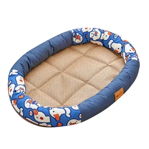 Oval summer pet cooling bed with blue cartoon duck border and woven cooling mat center.
