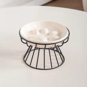 Elegant ceramic cat paw slow feeder pet bowl with a minimalist black iron stand frame