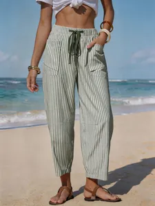 Detail of striped linen-like summer pants for beach vacation outfits