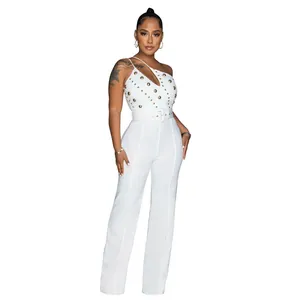Elegant one-shoulder white jumpsuit with gold studs and wide-leg trousers for parties