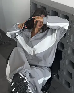 Oversized grey and white color block tracksuit set with zip-up jacket and loose pants