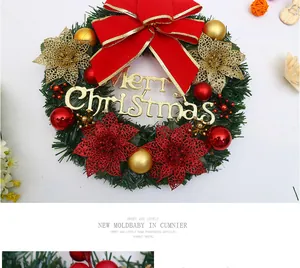 Festive Christmas wreath with red bow and gold Merry Christmas sign for home door decor