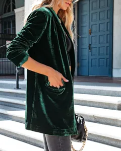Close-up showing the rich texture of this elegant green velvet loose fit lapel coat