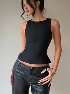 Detail view of a black sleeveless slim-fit peplum top with round neckline for women