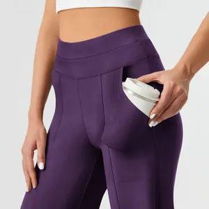 Close-up detail of high waist yoga pants showing a spacious side pocket for storage