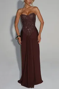 Close-up detail of a brown strapless evening gown with a shimmering sequined bodice