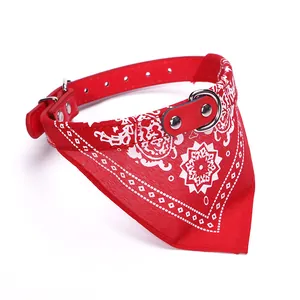 Detailed view of red PU leather pet collar with white floral print triangle bandana