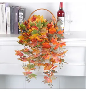 Detailed view of artificial autumn maple leaf vines with berries in a hanging basket